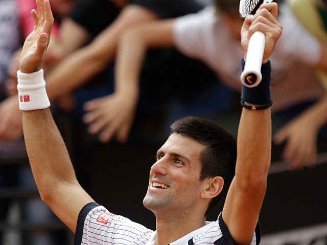 Novak Djokovic celebrates after defeating Alexandr Dolgopolov in the Rome Masters on May 16, 2013