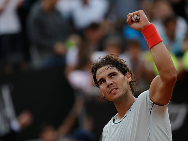 Rafael Nadal celebrates after defeating Ernests Gulbis at the Rome Masters on May 16, 2013
