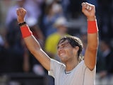 Spain's Rafael Nadal celebrates after defeating Switzerland's Roger Federer in the final of the Rome Masters on May 19, 2013