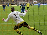 Hoffenheim's Sejad Salihovic scores the winner from the penalty spot against Dortmund on May 18, 2013