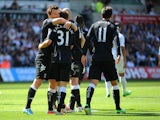 Fulham's Alexander Kacaniklic is congratulated after scoring against Swansea on May 19, 2013