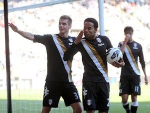 Fulham's Urby Emanuelson celebrates scoring his side's third goal against Swansea on May 19, 2013