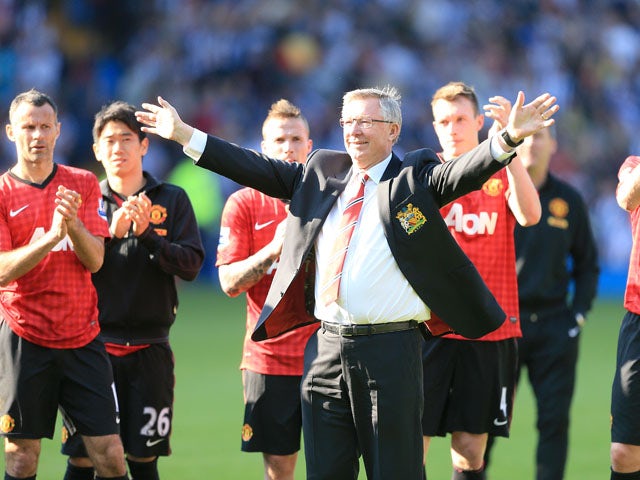 Manchester United manager Sir Alex Ferguson acknowledges the fans after his final game in charge of the club on May 19, 2013