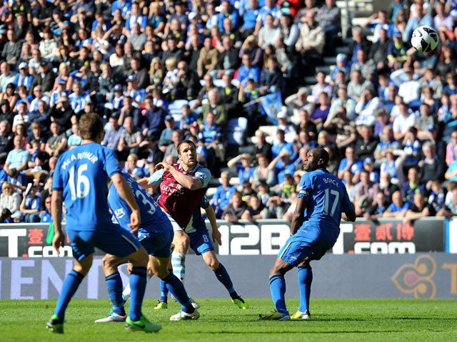 Aston Villa's Ron Vlaar scores his teams second goal in the Premier League match against Wigan on May 19, 2013