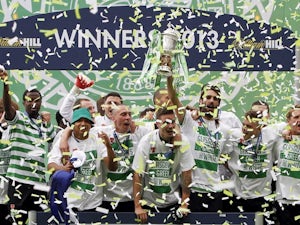 Celtic players celebrate winning the cup over Hibs on May 26, 2013
