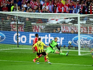 Borussia Dortmund's Jakub Blaszczykowski has his shot saved by Bayern Munich goalkeeper Manuel Neuer during the Champions League final on May 25, 2013