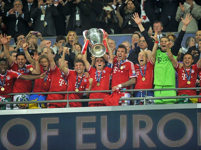 Bayern Munich players celebrate as they lift the UEFA Champions League trophy on May 25, 2013