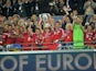 Bayern Munich players celebrate as they lift the UEFA Champions League trophy on May 25, 2013