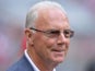 Munich's soccer legend Franz Beckenbauer looks on prior to the Bundesliga match between FC Bayern Munich and FC Freiburg on April 27, 2013