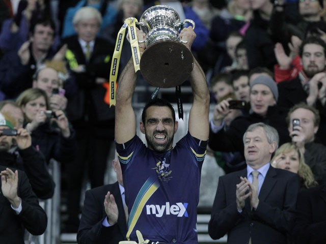 Australia's captain Adam Goodes lifts the International rules series trophy on October 30, 2010