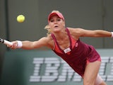 Agnieszka Radwanska returns the ball to Mallory Burdette during their second round match of the French Open on May 29, 2013