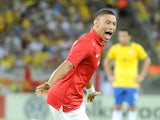 England's Alex Oxlade-Chamberlain celebrates after scoring the equaliser against Brazil during a friendly match on June 2, 2013