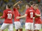 England's Alex Oxlade-Chamberlain is congratulated by team mates after scoring the equaliser against Brazil during a friendly match on June 2, 2013