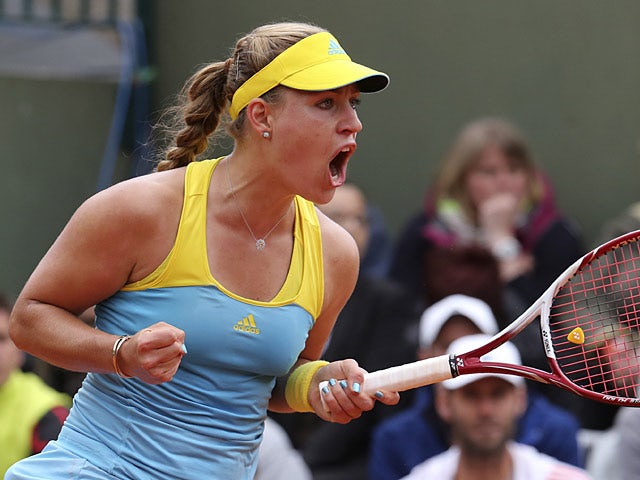 Angelique Kerber celebrates after defeating Jana Cepelova in their second round match of the French Open on May 29, 2013