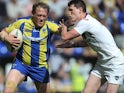Warrington Wolves' Ben Westwood is tackled by Salford City Reds' Ashley Gibson on June 2, 2013