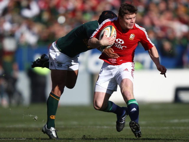 British and Irish lions player Brian O'Driscoll tries to break through a tackle from South Africa's Adi Jacobs on June 27, 2009