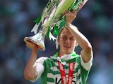 Yeovil Town's Dan Burn celebrates with the npower Football League One Play Off Final trophy on May 19, 2013