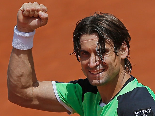 David Ferrer celebrates after defeating Kevin Anderson during their fourth round match of the French Open on June 2, 2013