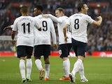 England's Frank Lampard celebrates his equaliser with team mates in the match against Ireland on May 29, 2013