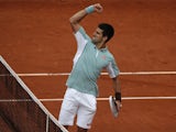 Serbia's Novak Djokovic reacts as he defeats Belgium's David Goffin during their first round match of the French Open tennis tournament on May 28, 2013