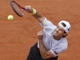 Germany's Tommy Haas serves against France's Guillaume Rufin during their first round match at the French Open tennis tournament on May 28, 2013