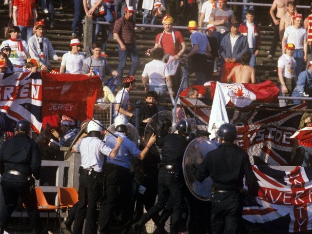 Police and Liverpool fans clash at Heysel.