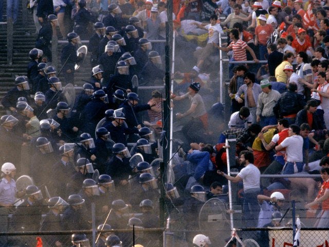 Liverpool fans clash with the Belgian police at Heysel Stadium.