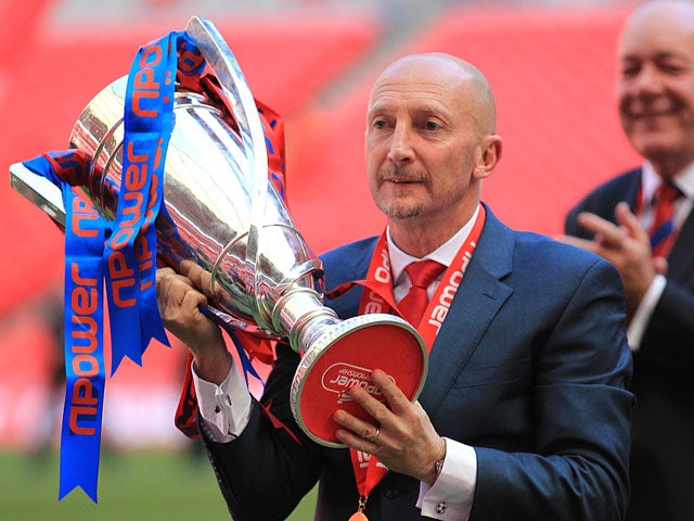 Crystal Palace manager Ian Holloway celebrates with the npower Football League Championship play off final trophy on May 27, 2013