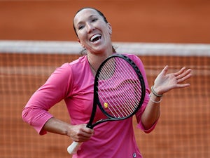 Jelena Jankovic celebrates after defeating Samantha Stosur during their third round match of the French Open on June 1, 2013