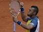 Jo-Wilfried Tsonga celebrates after defeating Jarkko Nieminen during their second round match of the French Open on May 29, 2013