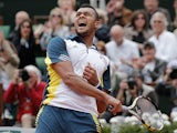 Jo-Wilfried Tsonga celebrates after defeating Viktor Troicki during their fourth round match of the French Open on June 2, 2013