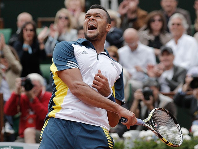 Jo-Wilfried Tsonga celebrates after defeating Viktor Troicki during their fourth round match of the French Open on June 2, 2013