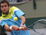 Marin Cilic returns the ball to Nick Kyrgios during their second round match of the French Open on May 29, 2013
