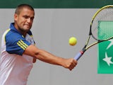 Mikhail Youzhny returns the ball to Janko Tipsarevic during their third round match of the French Open on June 1, 2013