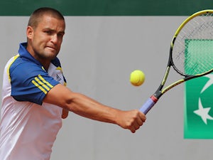 Mikhail Youzhny returns the ball to Janko Tipsarevic during their third round match of the French Open on June 1, 2013