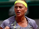Petra Kvitova celebrates after defeating Aravane Rezai during their first round match of the French Open on May 29, 2013