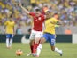 England's Phil Jones and Brazil's Luis Gustavo Dias battle for the ball during a friendly match on June 2, 2013