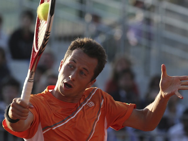 Philipp Kohlschreiber returns the ball to Victor Hanescu during their third round match on the French Open on June 1, 2013