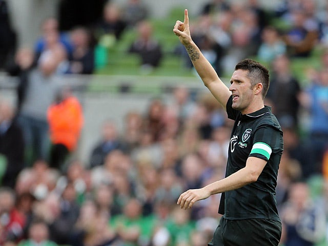 Ireland's Robbie Keane celebrates after scoring his team's third goal against Georgia in a friendly match on June 2, 2013