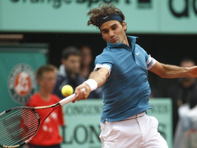Roger Federer plays a shot against Robin Soderling during the 2010 French Open.