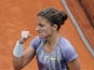 Sara Errani celebrates after defeating Sabine Lisicki during their third round match of the French Open on May 31, 2013