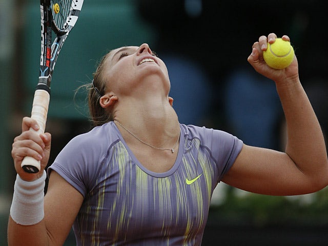 Sara Errani celebrates after defeating Carla Suarez Navarro during their fourth round match of the French Open on June 2, 2013