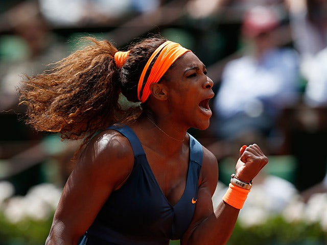 Serena Williams celebrates after defeating Roberta Vinci during their fourth round match of the French Open on June 2, 2013
