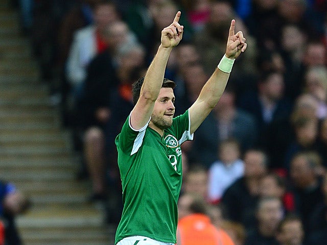 Ireland's Shane Long celebrates after scoring the opening goal against England on May 29, 2013