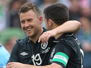 Ireland's Simon Cox celebrates with team mate Shane Long after scoring his team's second against Georgia in a friendly match on June 2, 2013