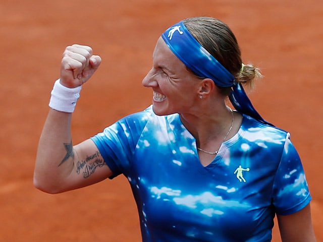 Svetlana Kuznetsova celebrates after defeating Angelique Kerber during their fourth round match of the French Open on June 2, 2013