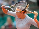 Victoria Azarenka returns the ball to Elena Vesnina during their first round match of the French Open on May 29, 2013
