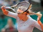 Victoria Azarenka returns the ball to Elena Vesnina during their first round match of the French Open on May 29, 2013