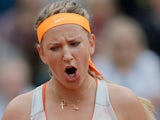 Victoria Azarenka celebrates after defeating Alize Cornet during their third round match of the French Open on June 1, 2013