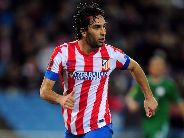 Turan plays down Chelsea, Liverpool moves